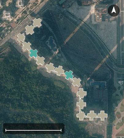 維景灣畔航空影像，15 座樓宇輪廓按風水評分上色，綠色分高、紅色分低